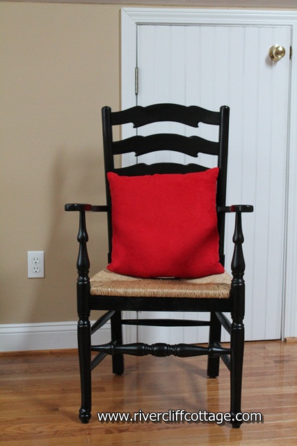 Black Chair With Red Pillow