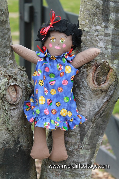 Little Black Doll in Tree