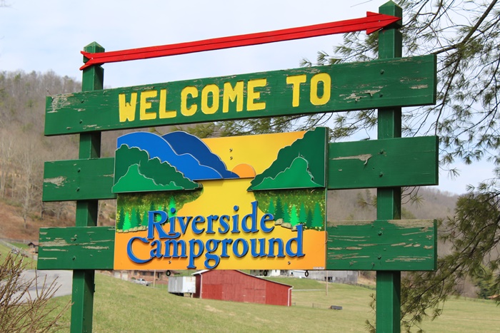 Riverside Campground sign in front